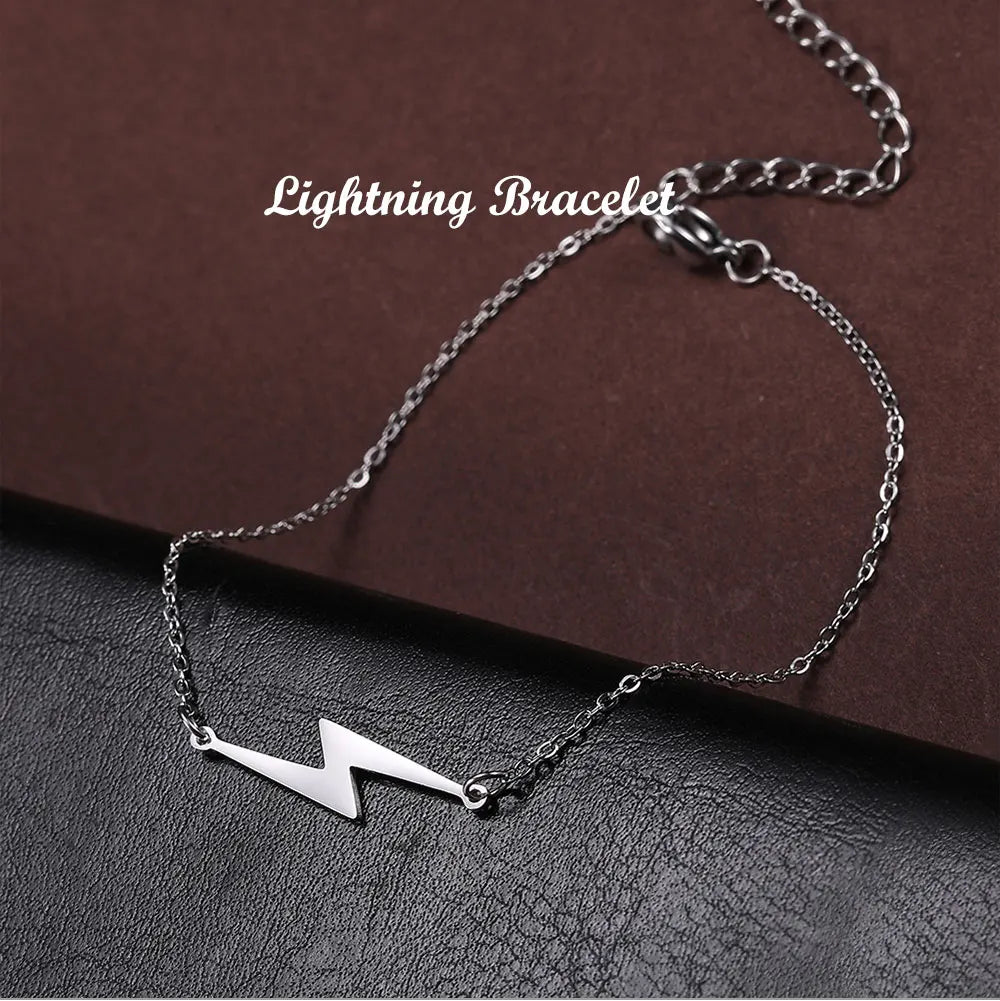 Silver-tone lightning charm bracelet with lightning bolt pendant