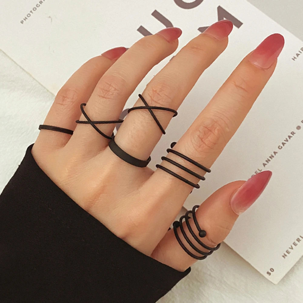 Black geometric knuckle rings with stacked band and bar detail