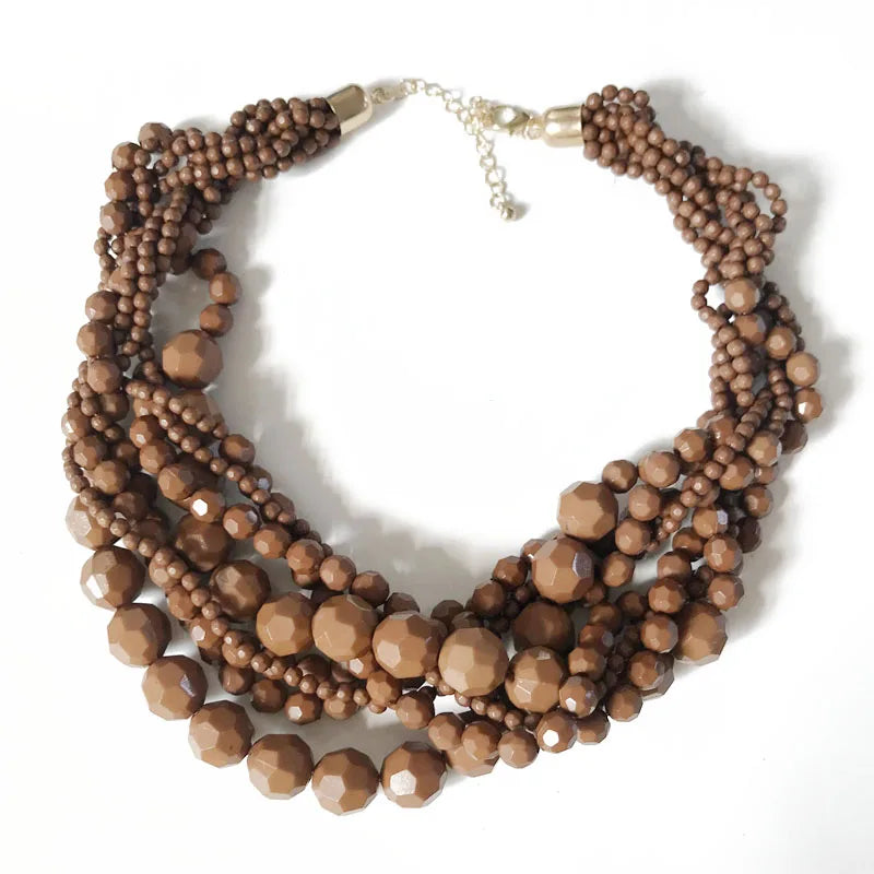 Bronze beaded choker necklace with braided bead strands and gold-tone clasp.