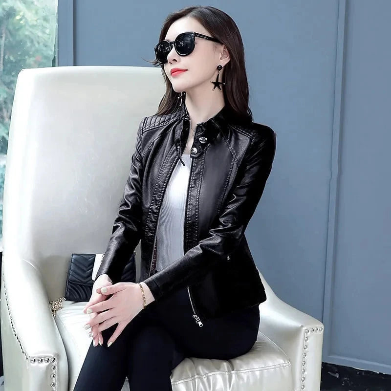 Black faux leather zip-up moto jacket with long sleeves and angled lapels