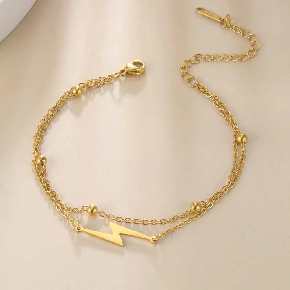 Gold-tone chain lightning charm bracelet with lightning bolt pendant