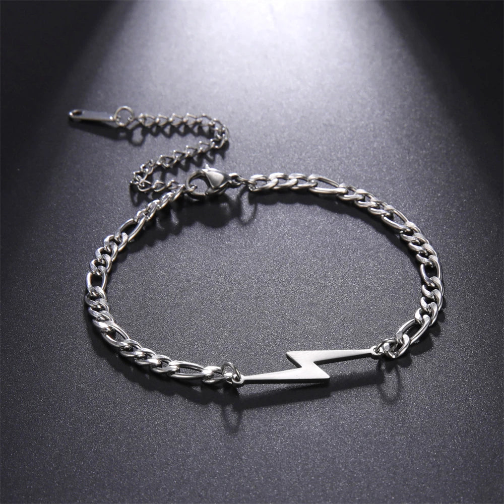 Silver tone lightning charm bracelet with chunky chain and white bolt centerpiece.