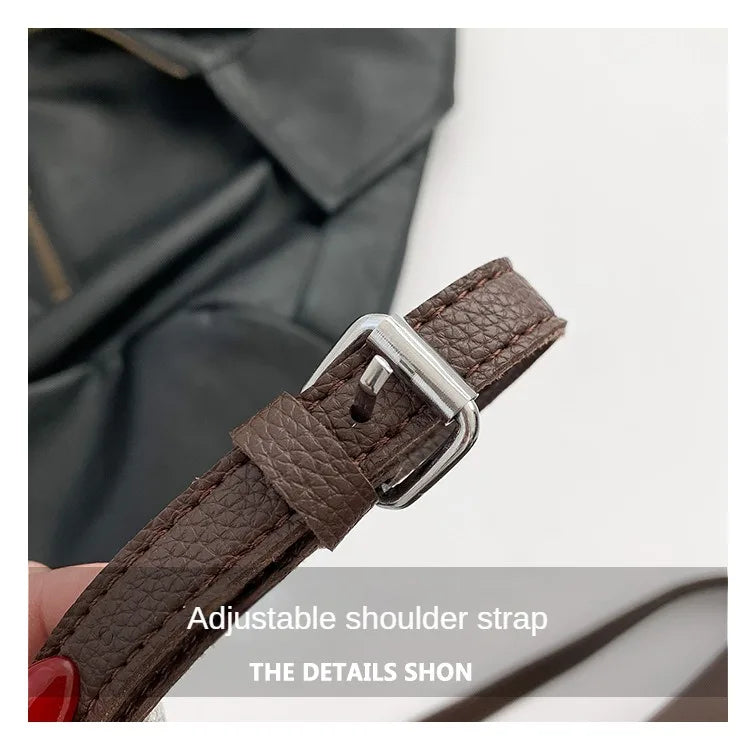 Adjustable brown PU leather crossbody strap with metal buckle and textured strap end