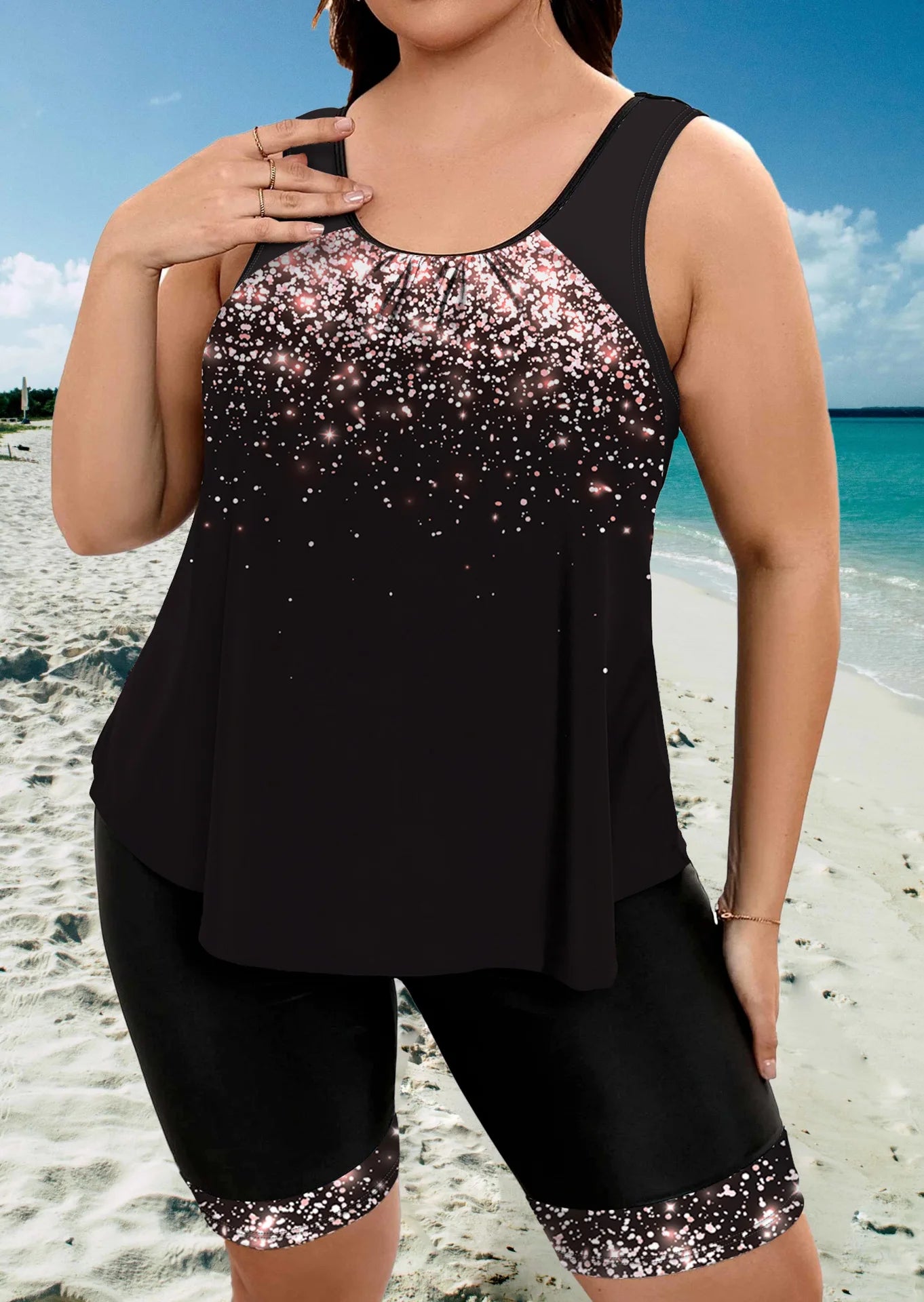Black tankini top with sparkle-speckled front and matching swim shorts