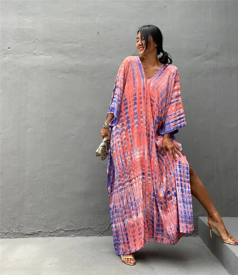 Women's beach kaftan tunic dress with pink, purple, and blue vertical tie-dye print