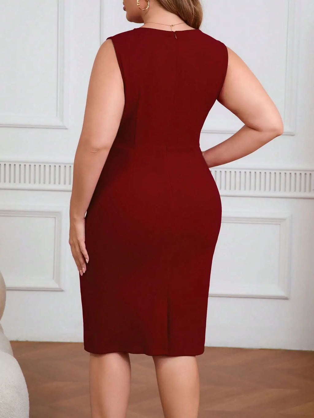 Burgundy sleeveless bodycon sheath dress with crew neck; rear view