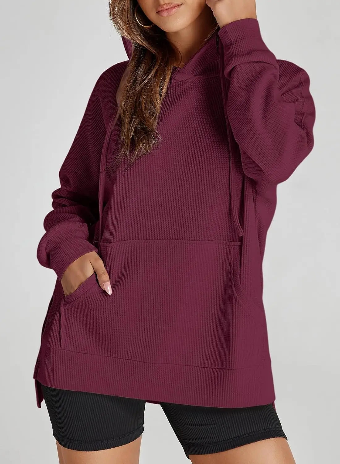 Plus size waffle knit pullover hoodie in maroon, with hood drawstrings and front pocket