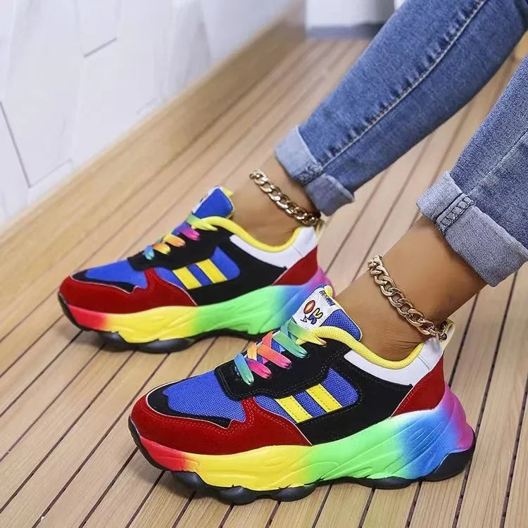 Color-block platform sneakers with blue, red, and neon green accents and thick sole