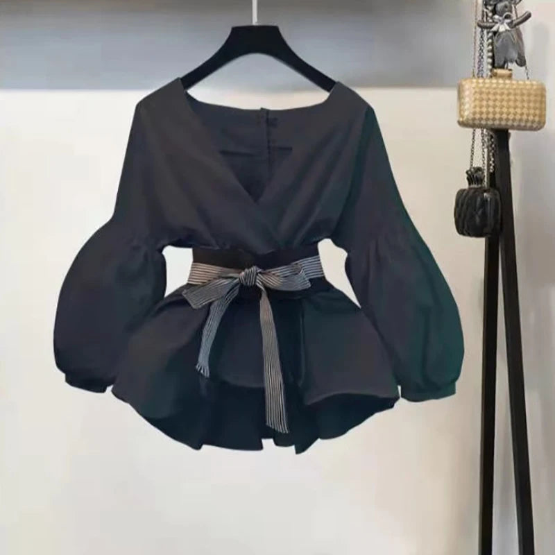 Black V-neck chiffon top with long sleeves and bow at the waist