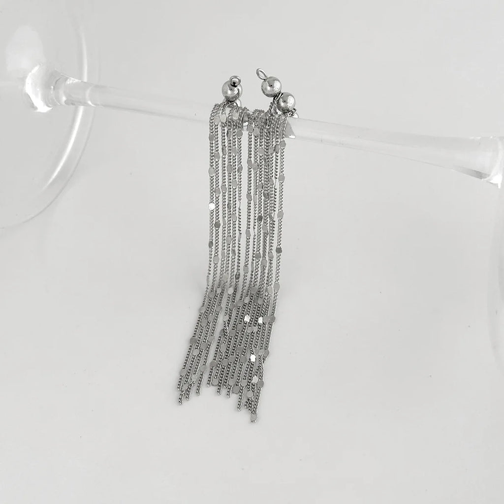 Pair of silver chain tassel ear clips hanging with round top accents
