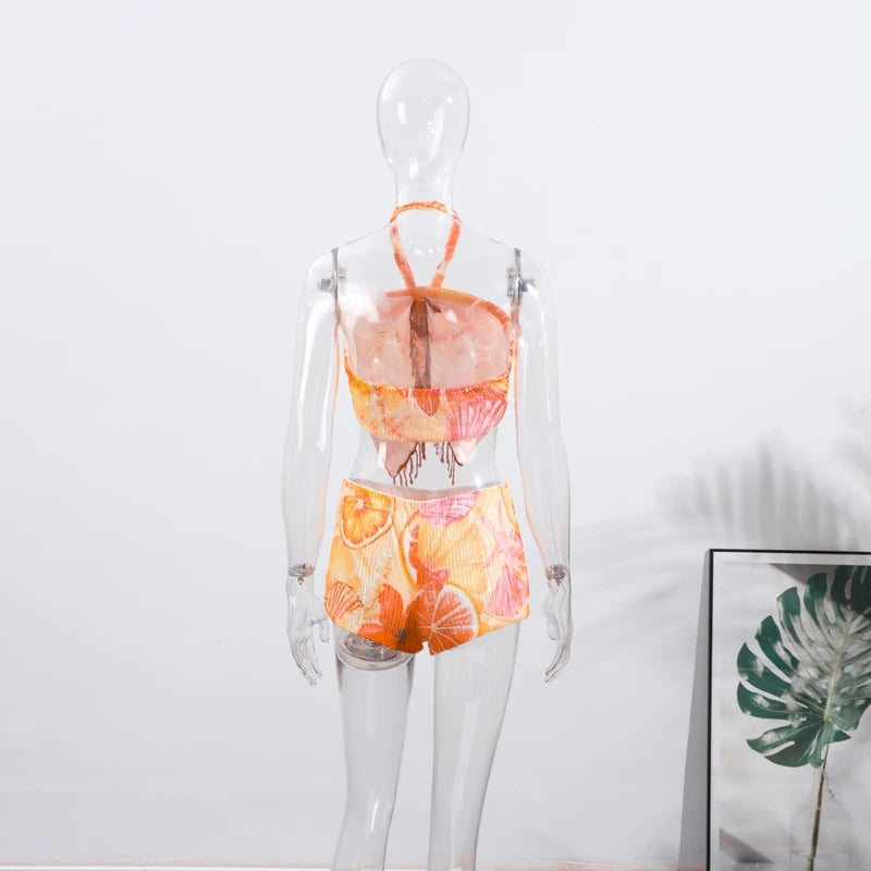 Halter crop top and shorts set on mannequin, citrus print two-piece with tie halter