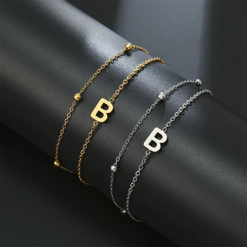 Initial letter bracelet set with B and B charms; gold and silver-tone chains