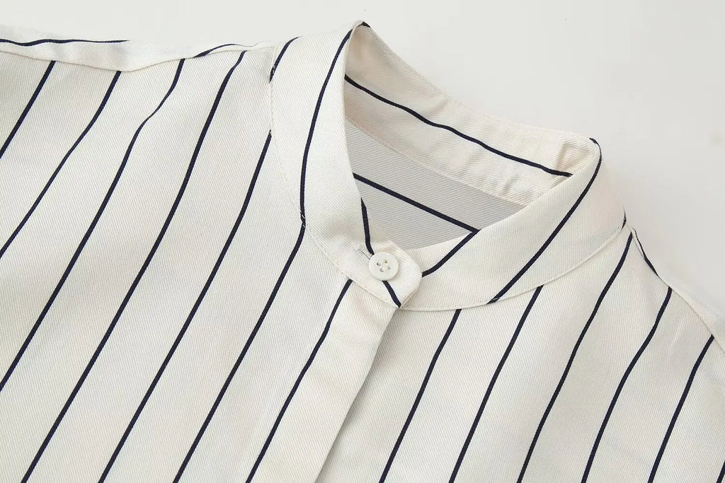 Striped button-up shirt collar and placket, off-white with navy vertical pinstripes