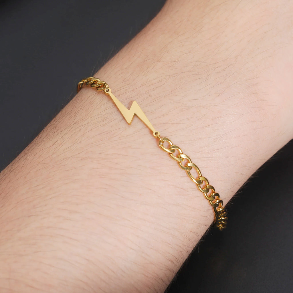 Gold-tone chain lightning bolt charm bracelet on wrist