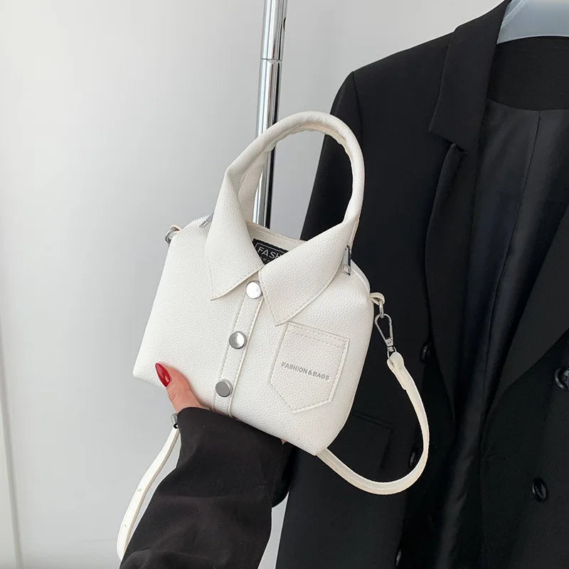 White square PU leather crossbody bag with top handle, chain strap, front snap pocket