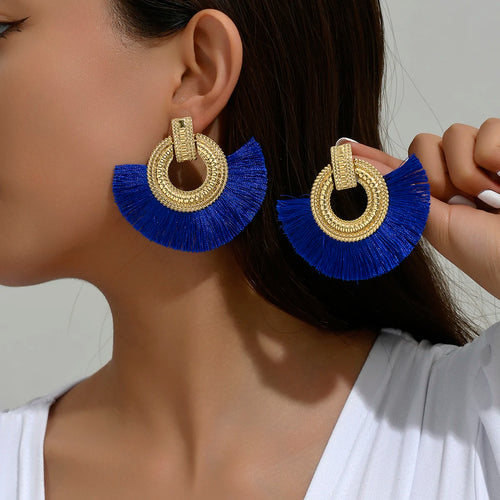 Gold-tone fan stud earrings with round crystal hoop and blue tassel fringes