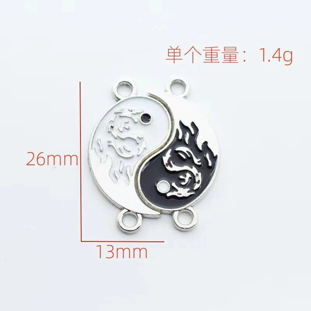 Yin-yang dragon charm connector with black and silver enamel, 26mm size shown