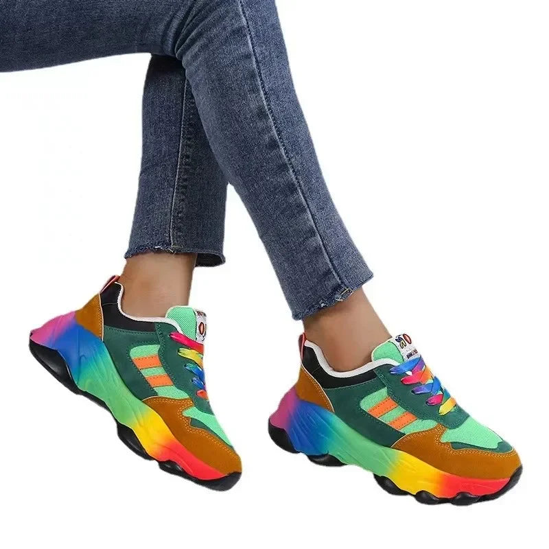 Green and brown platform sneakers with rainbow gradient sole and bright laces