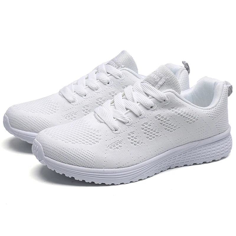 White mesh lace-up sneakers with textured perforation and cushioned white sole
