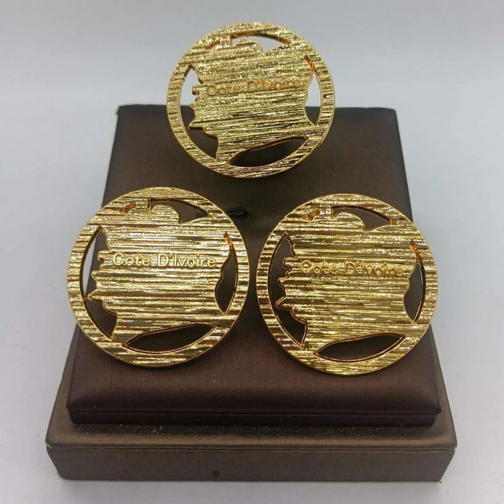 Gold-tone circular statement earrings with engraved back details