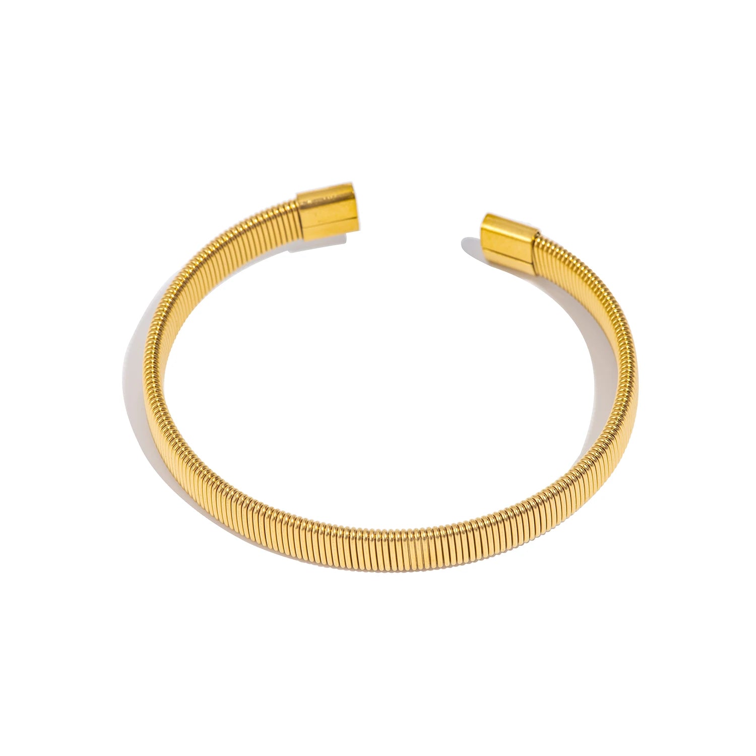 Gold-tone ribbed open bangle bracelet with flat clasp ends