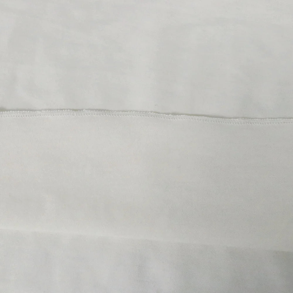 White women’s tank top hem, flat seam close-up