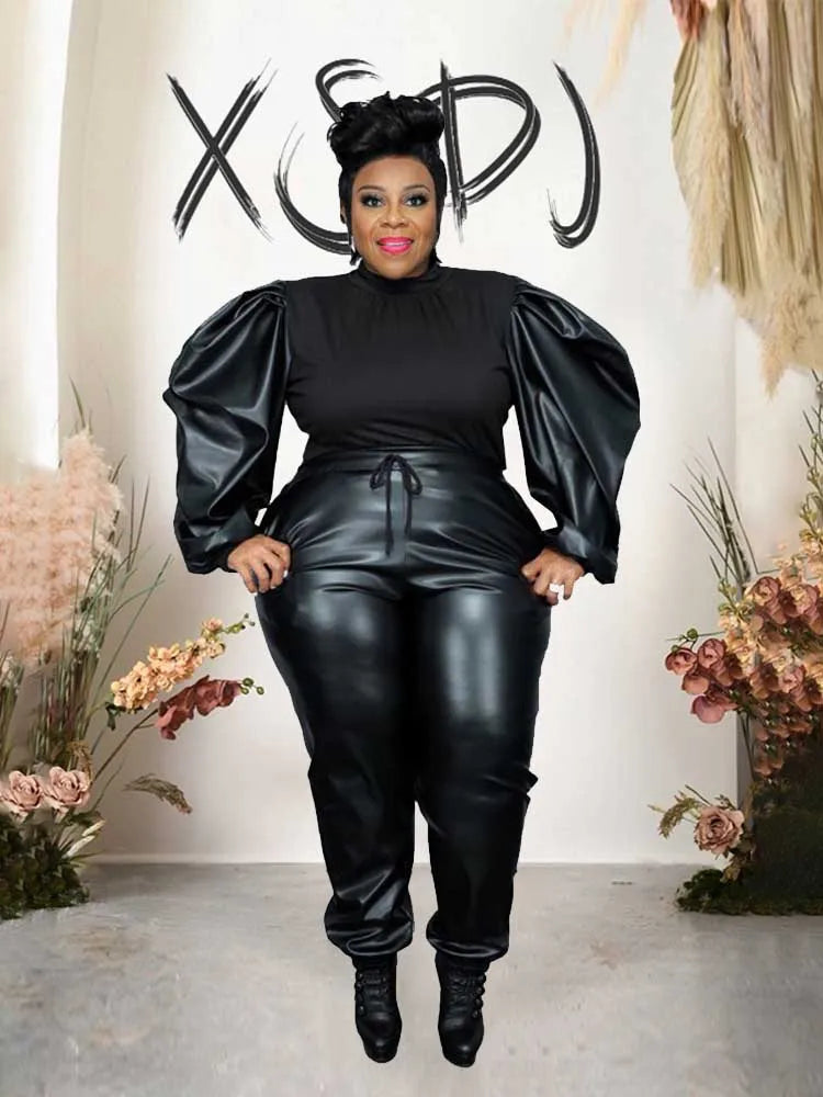Women's black puff-sleeve knit top and faux leather pants set with ruched waistband