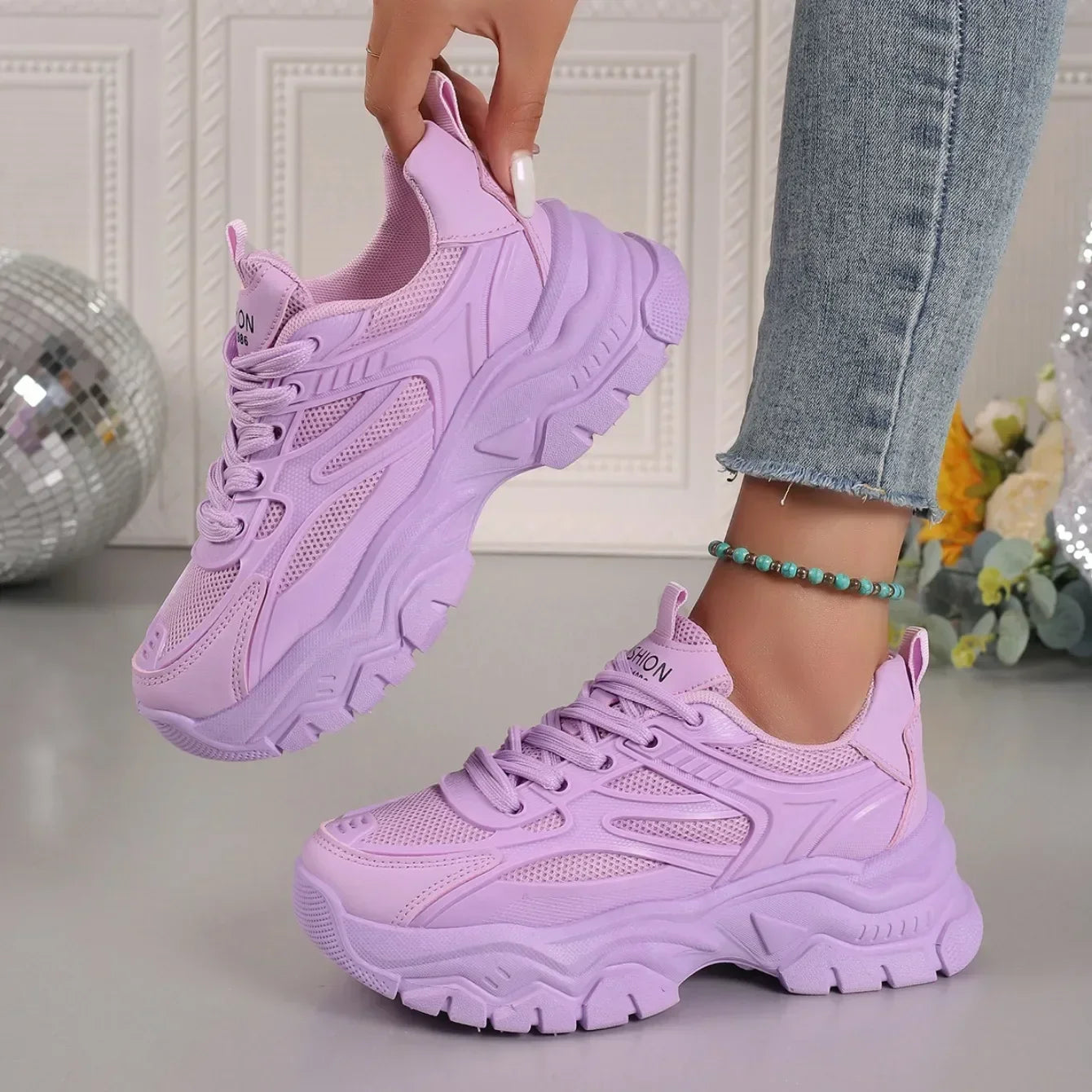 Lavender chunky platform lace-up sneakers showing front lace panel and thick tread