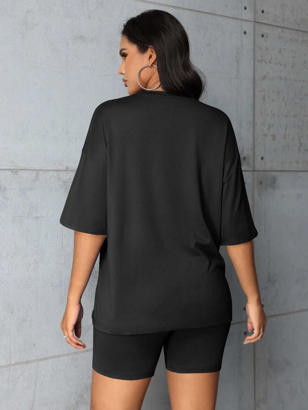 Women's plus size black t-shirt & shorts set, back view