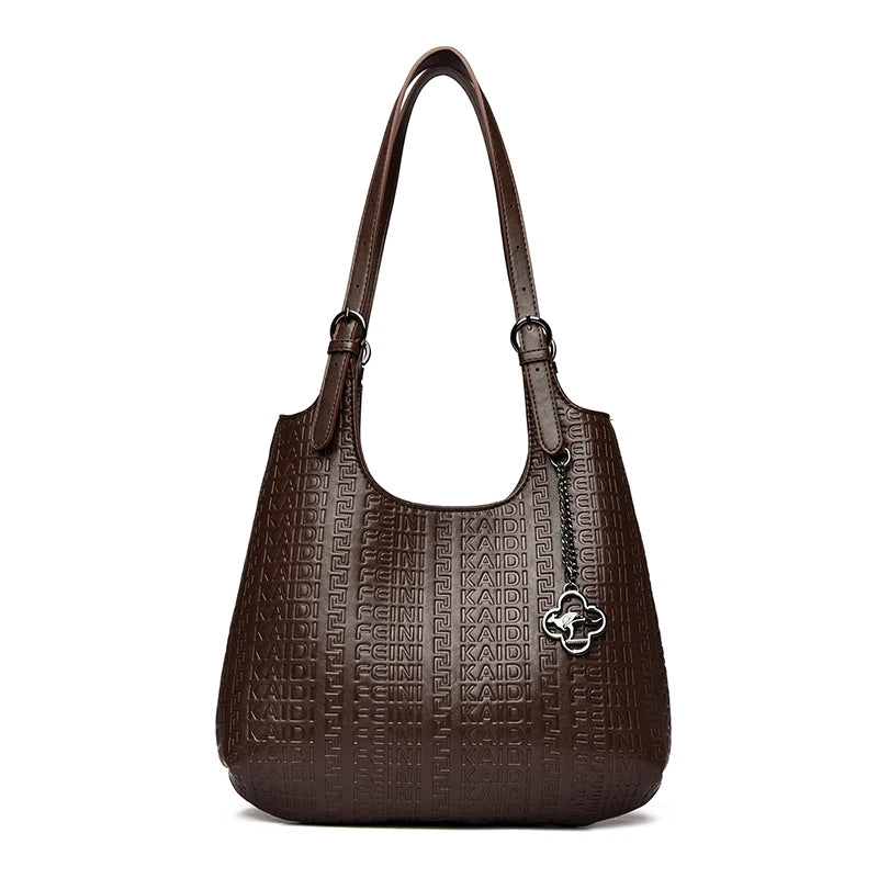 Dark brown embossed leather shoulder tote with top handles and flower logo charm