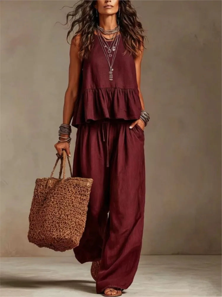 Burgundy ruffled sleeveless top and wide-leg trousers set with tiered peplum