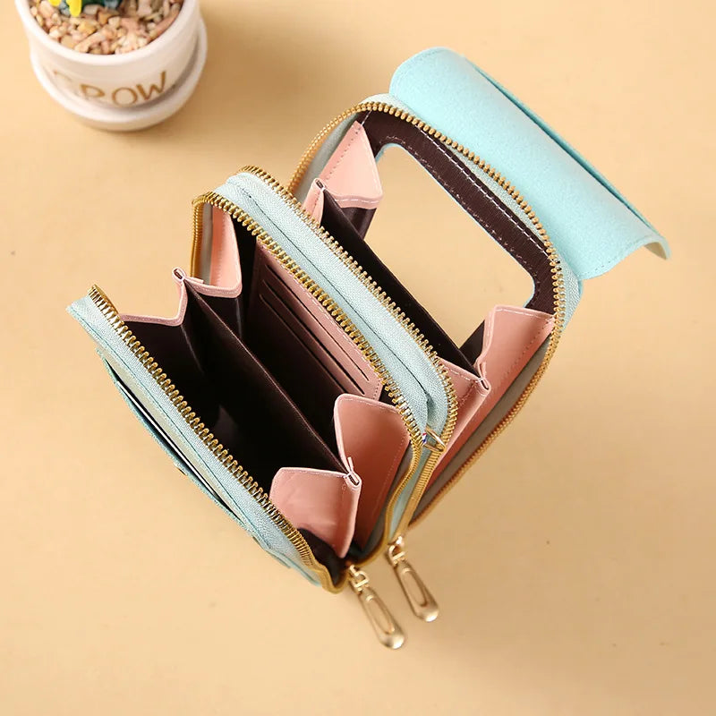 Light blue PU phone crossbody wallet, open with card slots and gold zippers.