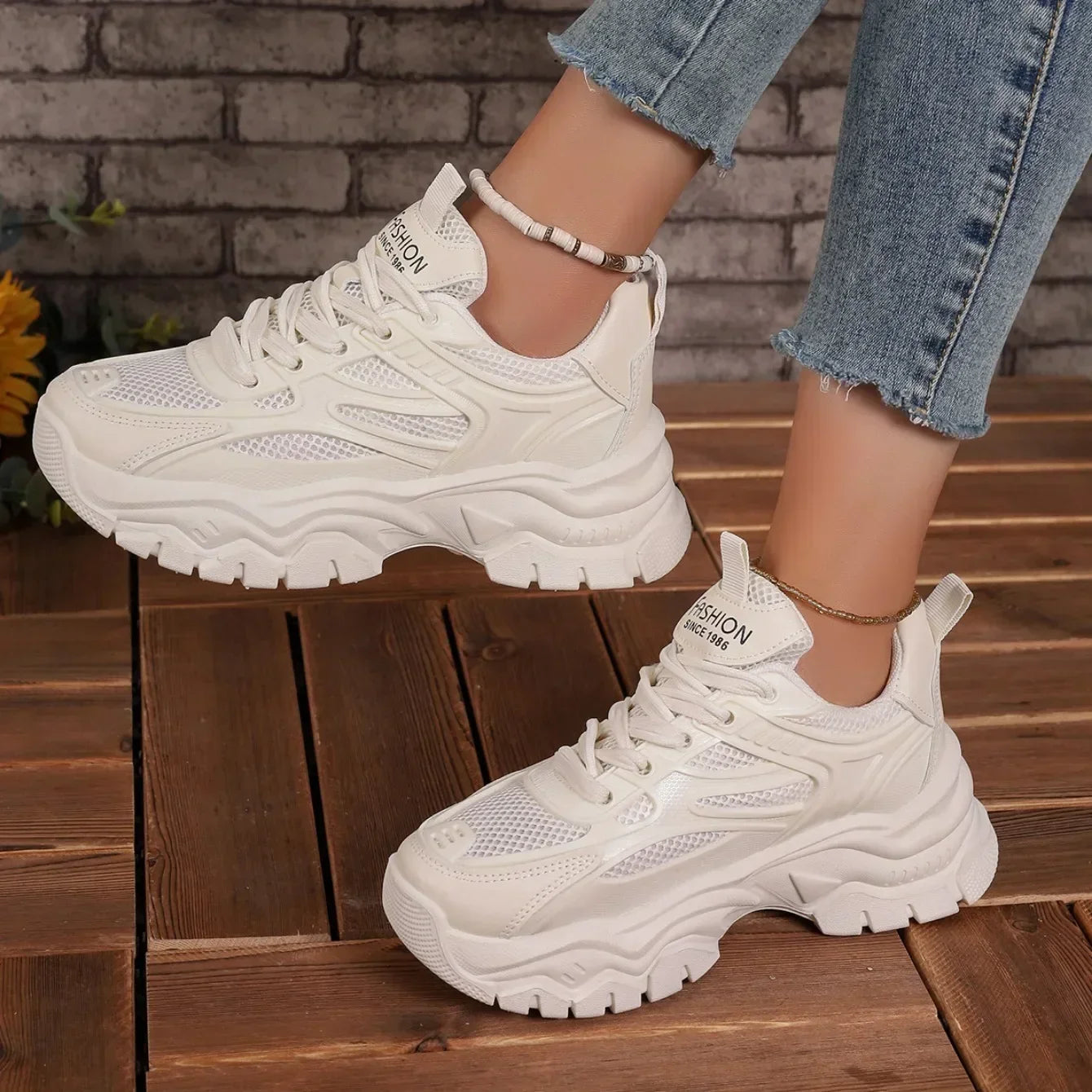 White chunky platform lace-up sneakers with lace-up front and oversized tread sole