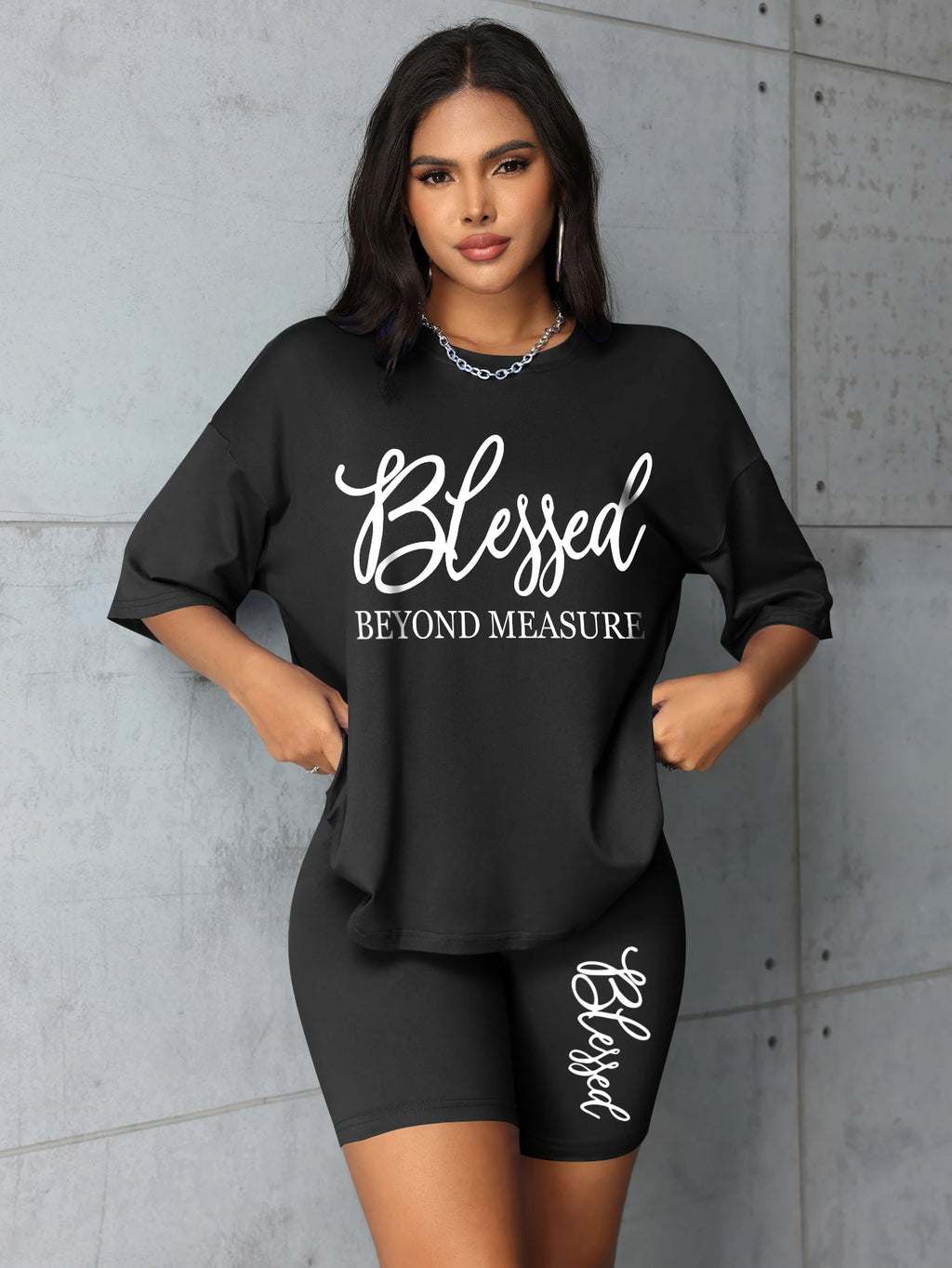 Women's plus size black t-shirt & shorts set with 'Blessed' text graphic