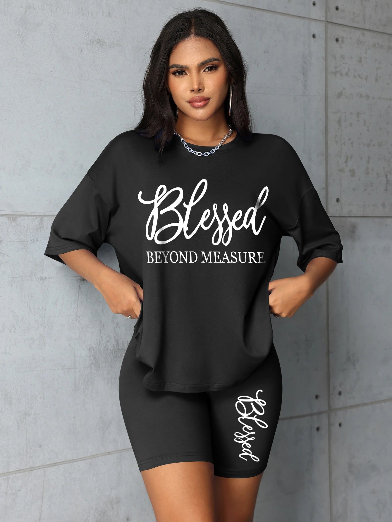 Women's plus size black t-shirt & shorts set with 'Blessed' text graphic