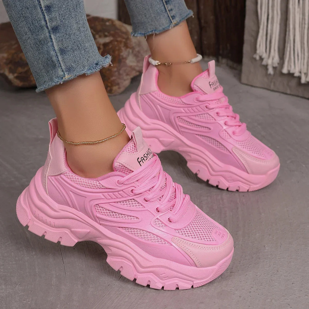 Pink chunky platform lace-up sneakers with mesh upper and chunky rubber sole