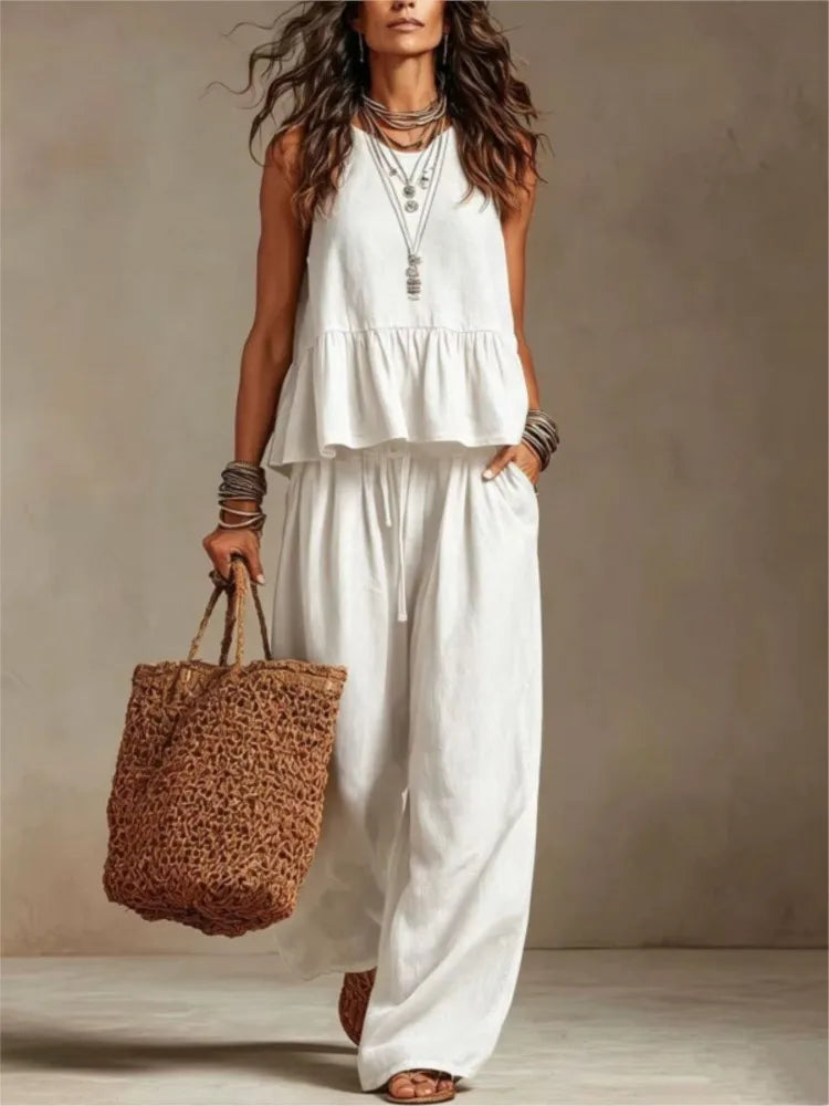 White ruffled sleeveless top and wide-leg trousers set, layered tiered ruffles