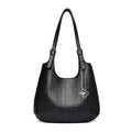 Black embossed leather shoulder tote with top handles and flower logo charm