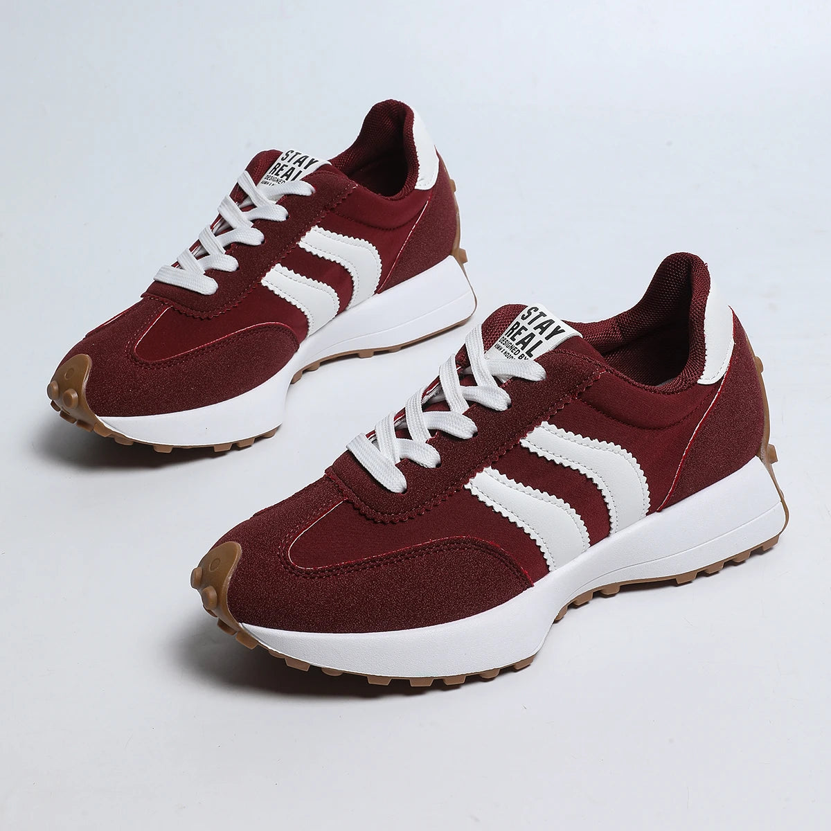 Women's lace-up sneakers, burgundy red with white side stripes and gum rubber sole