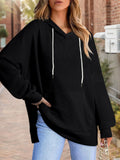 Plus-size black waffle-knit hooded sweatshirt with kangaroo pocket and drawstring