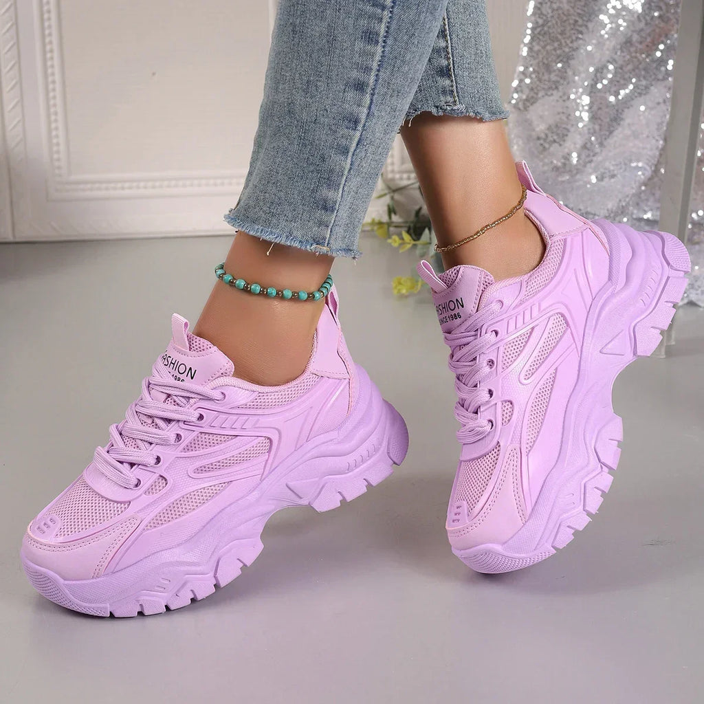Lavender chunky platform lace-up sneakers with textured panels and thick tread sole