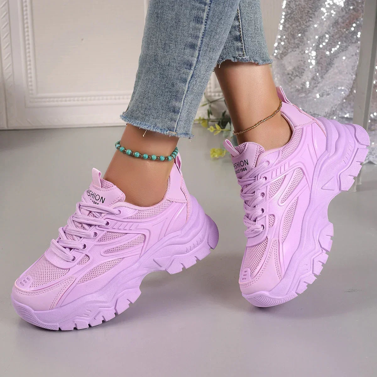 Lavender chunky platform lace-up sneakers with textured panels and thick tread sole