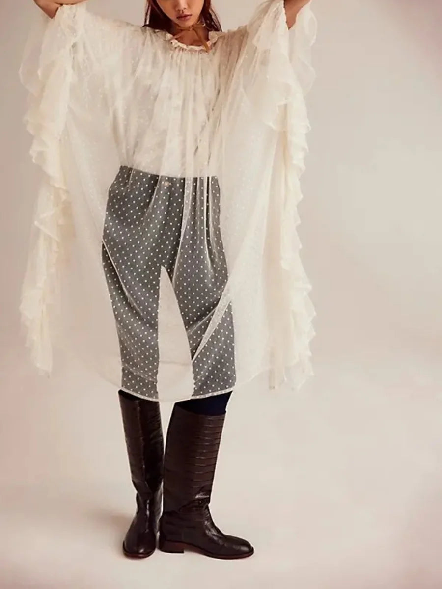 Sheer ivory poncho cover-up with dotted pattern and layered ruffled sleeves