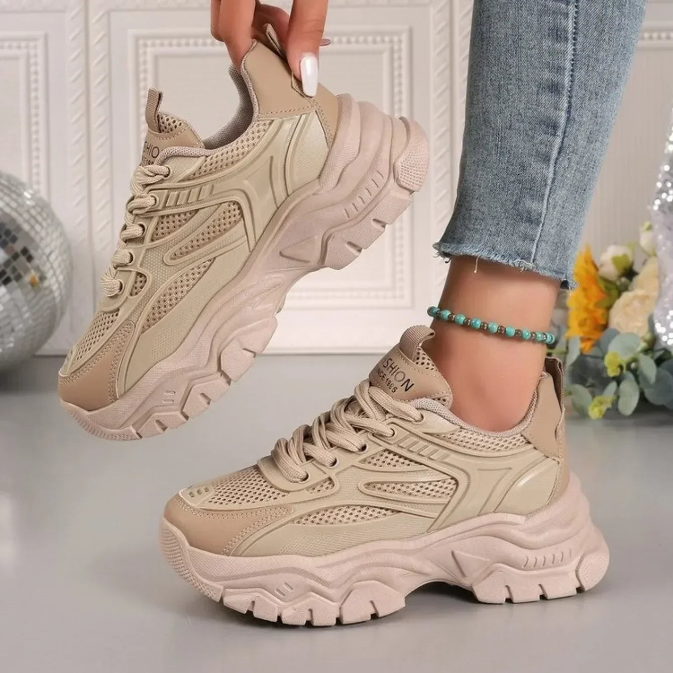 Beige chunky platform lace-up sneakers with breathable upper and thick tread sole
