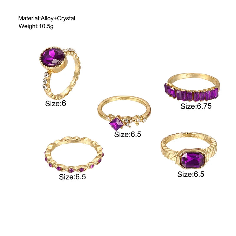 Gold-tone purple crystal ring set, including oval and baguette-style bands