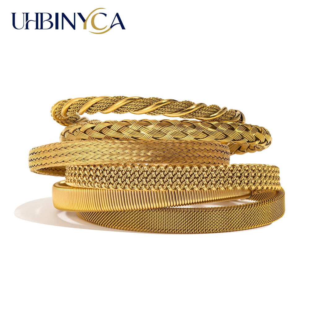 Gold open-end woven bracelet stack with braided and textured cuff designs