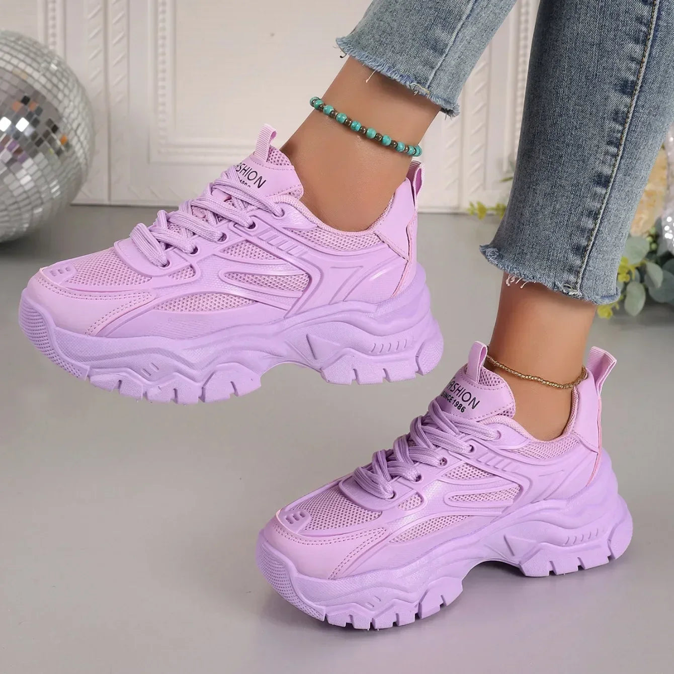 Lavender chunky platform lace-up sneakers with bold tread and lace-up vamp