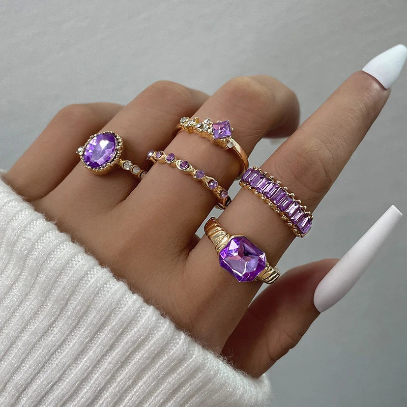5-piece rhinestone ring set, gold with purple oval and baguette crystal stones on hand
