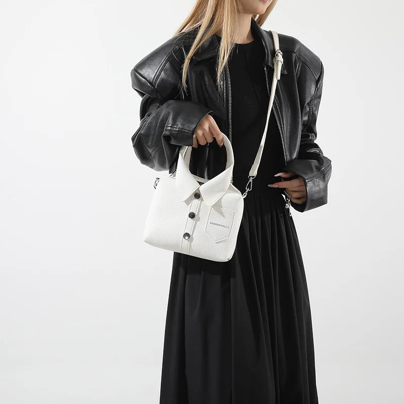 Black outfit with a white square PU leather crossbody bag featuring front snap buttons