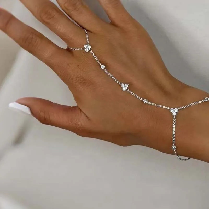 Silver rhinestone flower charm bracelet with small round links and dangling floral drops